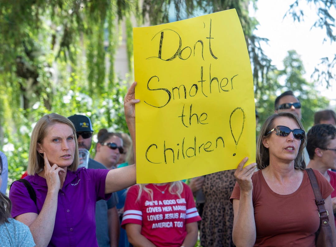 (Rick Egan  |  The Salt Lake Tribune)    Protesters listen as commissioner Bill Lee speaks during a rally protesting against masks being required in schools, before the Utah County Commission meeting in Provo, on Wednesday, July 15, 2020.
