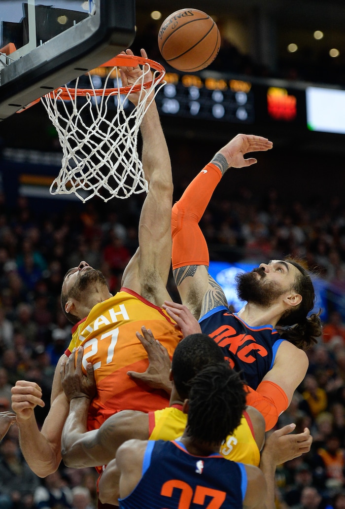 (Francisco Kjolseth  |  The Salt Lake Tribune)   Utah Jazz center Rudy Gobert (27) is pressured by Oklahoma City Thunder center Steven Adams (12) and Oklahoma City Thunder guard Terrance Ferguson (23) in the NBA game at Vivint Smart Home Arena Sat., Dec. 22, 2018, in Salt Lake City.