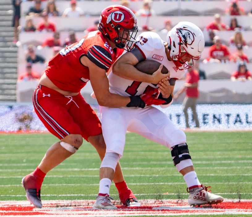 (Rick Egan | The Salt Lake Tribune) Utah Utes linebacker Lander Barton (20) sacks Southern Utah Thunderbirds quarterback Justin Miller (12), in football action between the Utah Utes and the Southern Utah Thunderbirds, at Rice-Eccles Stadium, on Saturday, Sept. 10, 2022.