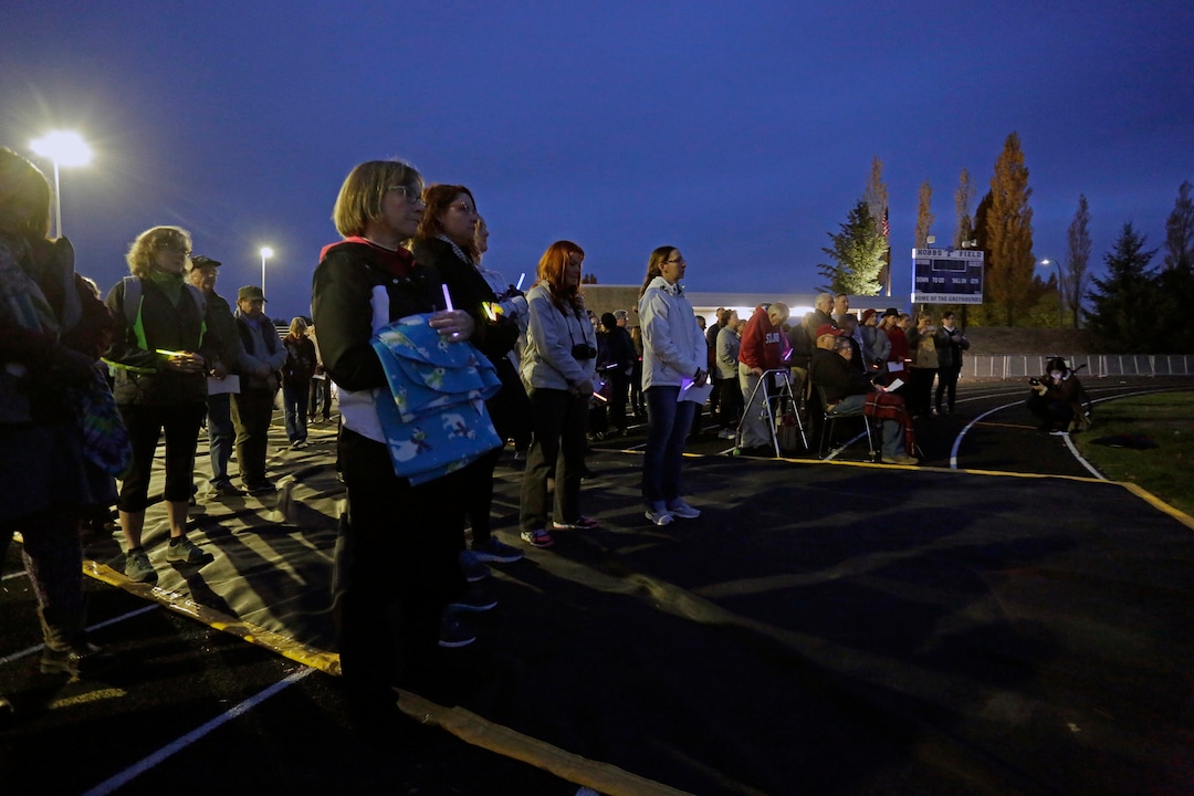 (Kai Eiselein  |  The Moscow-Pullman Daily News via AP)  Attendees listen to a speaker at a vigil for slain Pullman High School graduate and University of Utah communications major and track athlete, Lauren McCluskey, Wednesday, Oct. 24, 2018, in Pullman, Wash. Police said Melvin Rowland, 37, fatally shot 21-year-old McCluskey of Pullman, on Monday night on the university campus and then killed himself in a church as officers closed in.