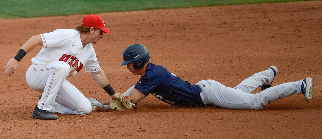 (Francisco Kjolseth  |  The Salt Lake Tribune)  Oliver Dunn denies a second base steal attempt by Danny Gelalich as Utah and BYU renew their rivalry on the baseball diamond as they battle it out at Smith's Ballpark in Salt Lake City on Tuesday, May 14, 2019.