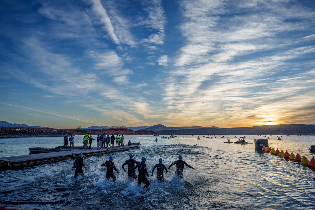 (Trent Nelson  |  The Salt Lake Tribune) Competitors rush into the water at in the Ironman World Championship triathlon in St. George on Saturday, May 7, 2022.