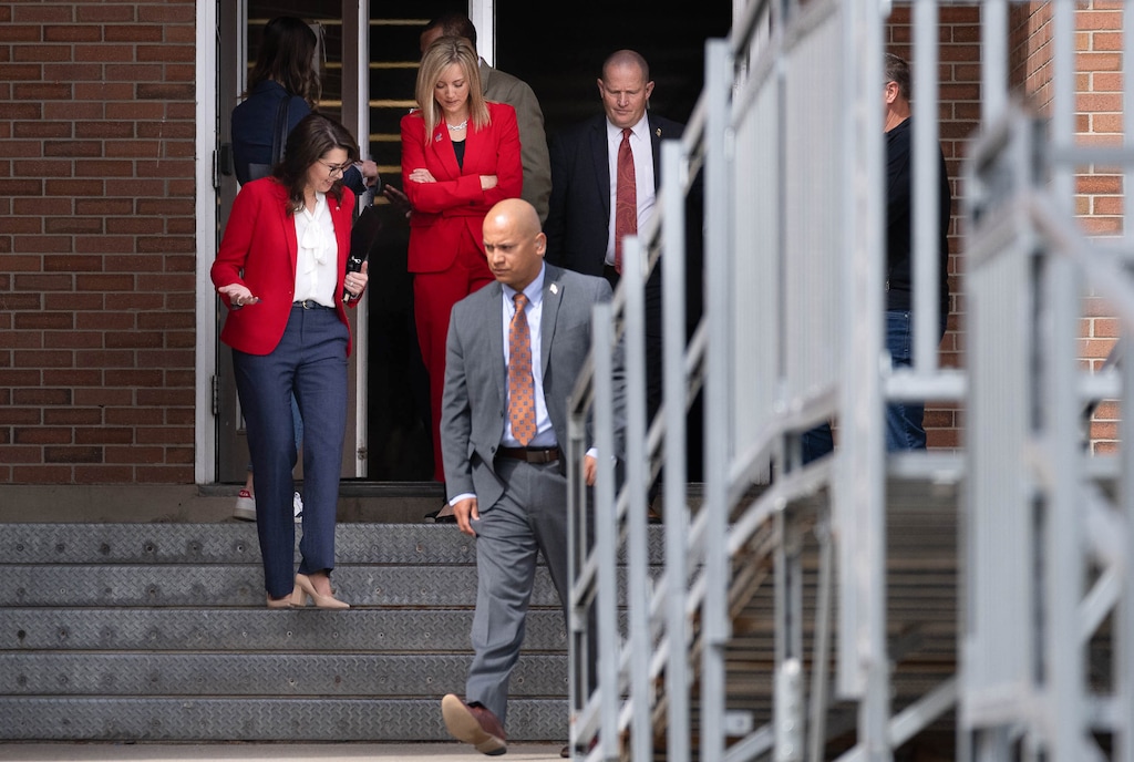 (Francisco Kjolseth | The Salt Lake Tribune) Lt. Gov. Deidre Henderson, left, speaks with a few state representatives as she is escorted to her vehicle by her security detail after speaking at the Salt Lake County Republican convention at Kearns High School on Saturday, April 9, 2022.