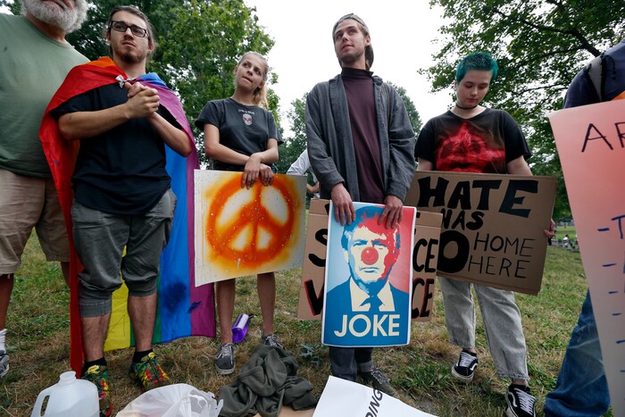 Counterprotesters wait for the start of a planned "Free Speech" rally on Boston Common, Saturday, Aug. 19, 2017, in Boston.  Police Commissioner William Evans said Friday that 500 officers, some in uniform, others undercover, would be deployed to keep the two groups apart.  (AP Photo/Michael Dwyer)
