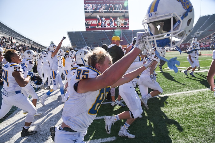 (Francisco Kjolseth  |  The Salt Lake Tribune)  Orem celebrates after winning the 4A high school championship game against Dixie at Rice-Eccles Stadium in Salt Lake City, Friday, Nov. 16, 2018. 