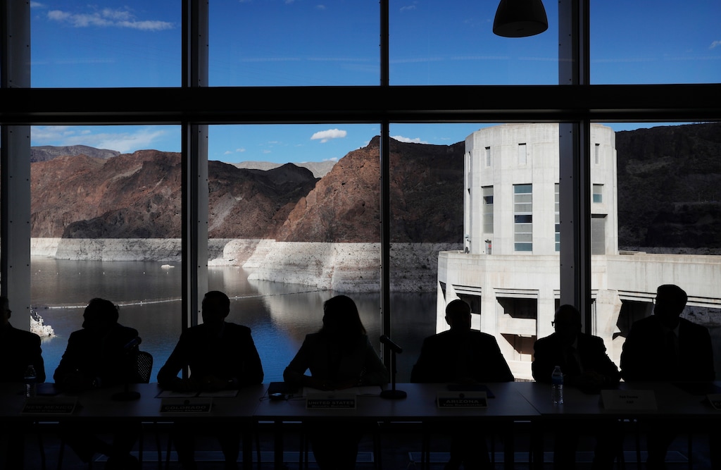 (John Locher | AP) Representatives from seven states and the federal government sit during a news conference at Hoover Dam before a ceremony for a Colorado River drought contingency plan, Monday, May 20, 2019, in Boulder City, Nev.