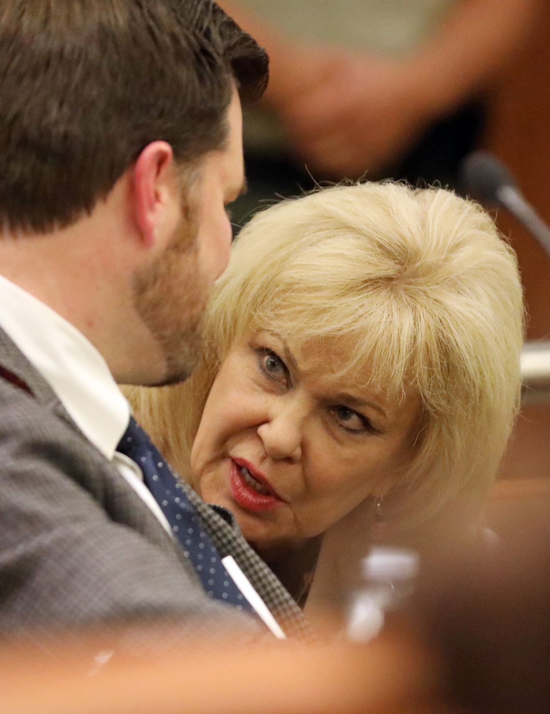 Salt Lake County Clerk Sherrie Swensen speaks with Deputy Salt Lake County District Attorney Adam Miller during arguments in Third District Court Thursday Nov. 15, 2018, in West Jordan, Utah. A Utah judge has reserved a decision on a lawsuit in a tight House race filed by a Republican incumbent who is seeking to halt vote counting in a Democratic-leaning county that's key to the outcome. Judge James Gardner heard arguments Thursday in the lawsuit filed by U.S. Rep Mia Love, but ended the hearing without making a ruling. (AP Photo/Rick Bowmer, Pool)