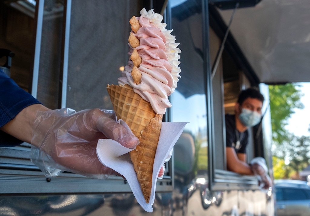 (Leah Hogsten | The Salt Lake Tribune) A Berry Delicious cone made with strawberries and Golden Grahams cereal mixed into vanilla ice cream, served in a waffle cone. The Spilled Milk food truck serves soft serve ice cream made with your favorite Saturday morning cereal, including Fruity Pebbles, Cap'n Crunch, Apple Jacks, Reese's Puffs, Cookie Crisp and Golden Grahams.