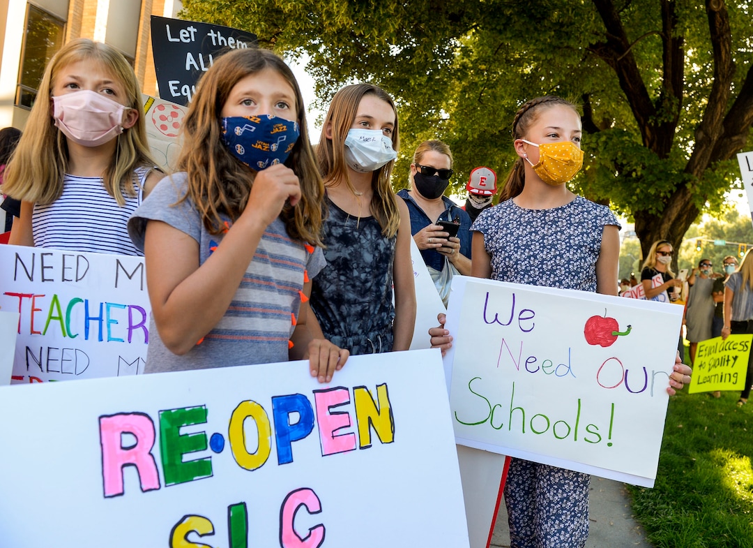 (Leah Hogsten  |  The Salt Lake Tribune) Parents and students within the Salt Lake City School District rally for K-12 students to return in-person to school this fall, July 15, 2020.