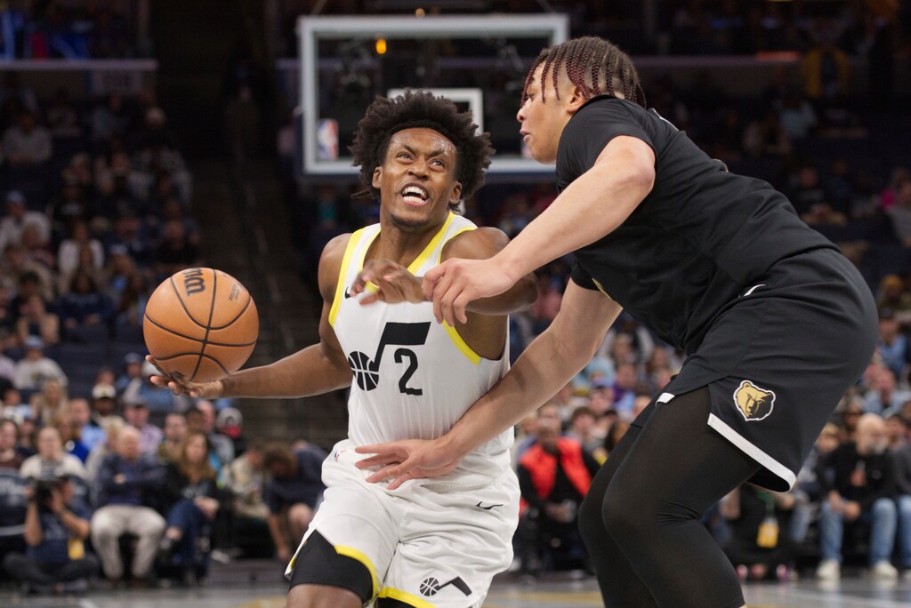 Utah Jazz guard Collin Sexton (2) drives against Memphis Grizzlies forward Kenneth Lofton Jr.(6) during the first half of an NBA basketball in-season tournament game Friday, Nov. 10, 2023, in Memphis, Tenn. (AP Photo/Nikki Boertman)