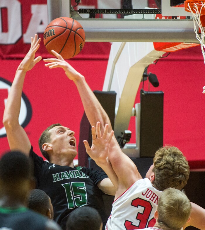 (Rick Egan  |  The Salt Lake Tribune)  Utah Utes forward Jayce Johnson (34) shoots over Hawaii Warriors forward Gibson Johnson (21), in basketball action, Utah Utes vs Hawaii Warriors, at the Jon M. Huntsman Center, Saturday, December 2, 2017.
