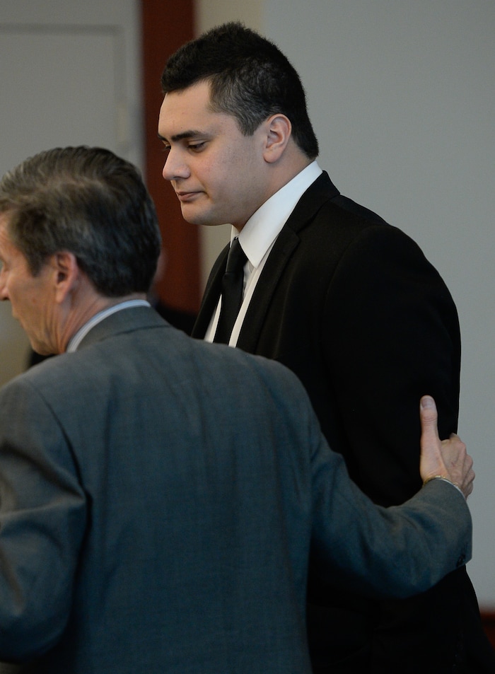 (Francisco Kjolseth  |  The Salt Lake Tribune)  Former Brighton High and University of Southern California linebacker Osa Masina goes before the judge alongside his defense attorney Greg Skordas at the Matheson Courthouse in Salt Lake City on Tuesday, Dec. 5, 2017. Masina was sentenced to 365 days in jail, followed by two years on probation for sexual battery.