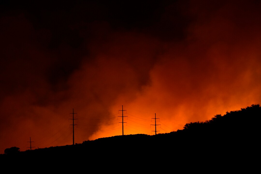 (George Frey  |  for The Salt Lake Tribune) A wildfire burns on Traverse Mountain above Lehi, Uta,h on June 28th, 2020.