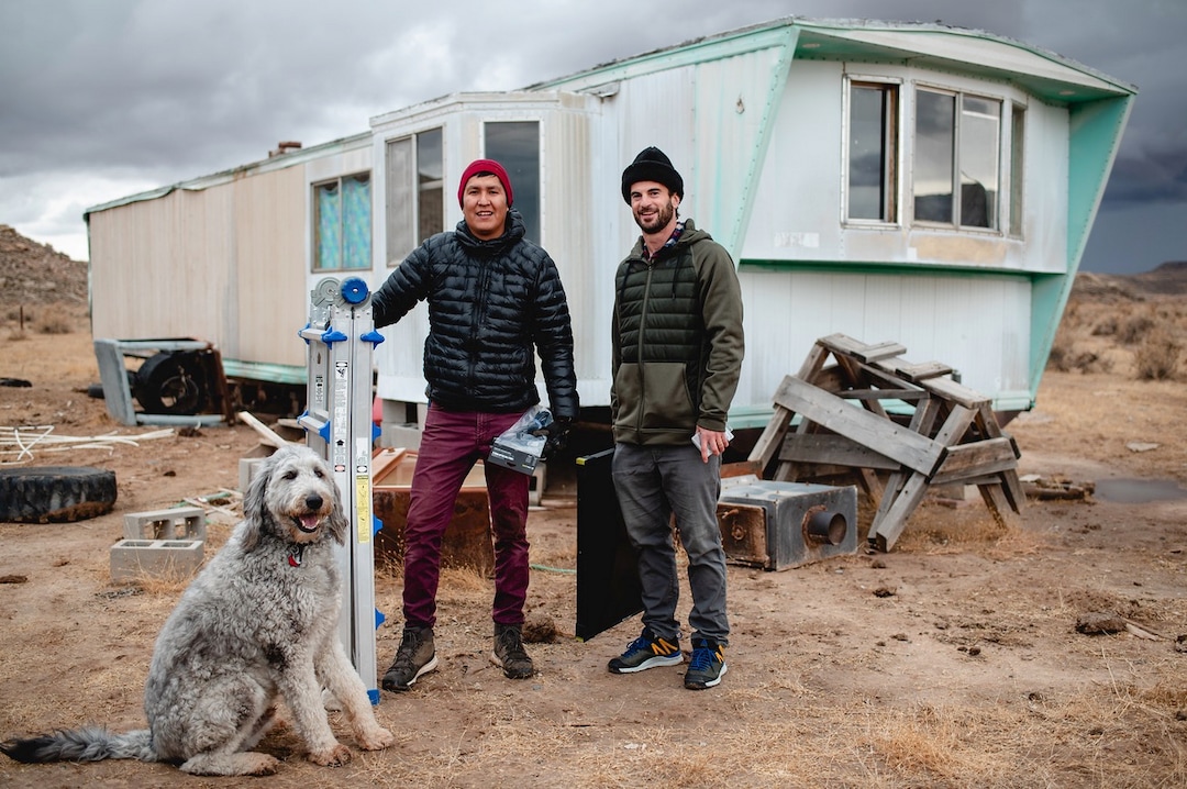 (Courtesy of Laura Dearden | Real Salt Lake Foundation) Photographer Mylo Fowler (Diné) and professional soccer player Kyle Beckerman install a solar set-up at a home in San Juan County in November 2019.