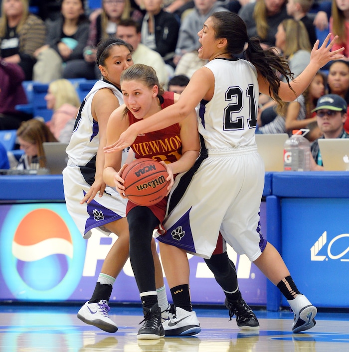Steve Griffin  |  The Salt Lake TribuneViewmont's Mercedes Staples (12) splits the defense Riverton's Tia Yazzie (10) and Riverton's Kiana Tai (21) as she escapes a trap during second round in the girl's 5A basketball state tournament at SLCC in Taylorsville, Wednesday, February 18, 2015. 