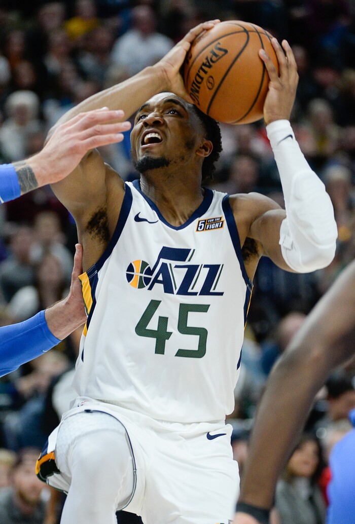 (Francisco Kjolseth  |  The Salt Lake Tribune)  Utah Jazz guard Donovan Mitchell (45) pushes through the defense as the Utah Jazz host the Oklahoma City Thunder in their NBA basketball game at Vivint Smart Home Arena in Salt Lake City on Mon. Dec. 9, 2019.