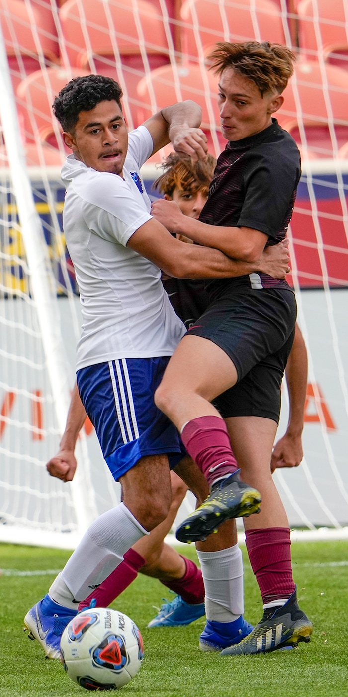 (Leah Hogsten | The Salt Lake Tribune) Real's Jesus Cruz battles Layton's Joao Gallo as Real Salt Lake Academy meets Layton Christian Academy for the 3A State Soccer Championship title at Rio Tinto Stadium, Wednesday, May 11, 2022. Layton Christian Academy won the title 4-0. 