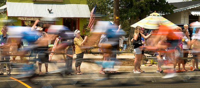 Leah Hogsten | The Salt Lake Tribune Tour of Utah fans and enthusiasts cheer Tour of Utah cyclists along Kamas' Main Street during Stage 6 on Sunday, August 12, 2018.