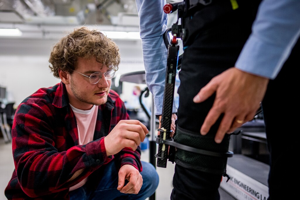 (Trent Nelson  |  The Salt Lake Tribune) Brendon Ortolano helps Tommaso Lenzi put on an exoskeleton that can assist leg amputees at the University of Utah on Wednesday, Oct. 13, 2021.