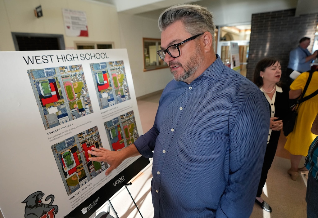 (Francisco Kjolseth | The Salt Lake Tribune) Brian Peterson, a project manager with VCBO Architecture, talks about four different plans being proposed to rebuild West High School on Thursday Sept. 12, 2024. Salt Lake City School District hosted an open house at West High to showcase the proposed $730 million bond to rebuild the aging school along with Highland High School.