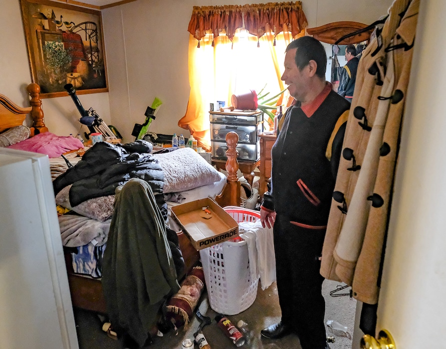 (Francisco Kjolseth  |  Tribune file photo) Roberto Duran points out the damage to his mobile home after many were knocked off their foundations during a magnitude 5.7 earthquake that hit near Magna on Wednesday, March 18, 2020.