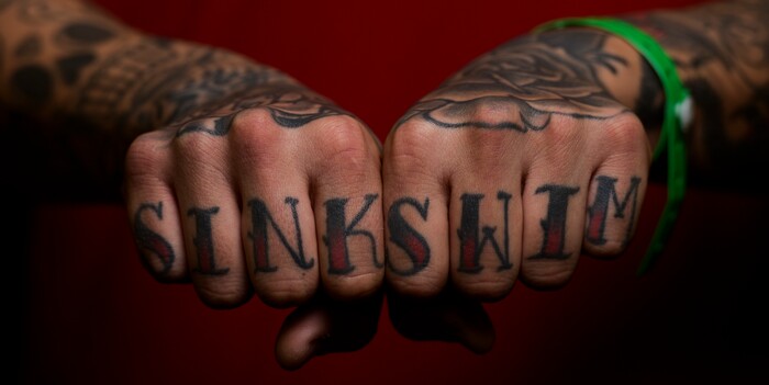 (Leah Hogsten | The Salt Lake Tribune) Jacob Lopez of Salt Lake City shows off his "sink or swim" tattoo at the Salt Lake City International Tattoo Convention, Saturday, March 17, 2018. Lopez has 36 tattoos and attends the convention every year looking for new body art.