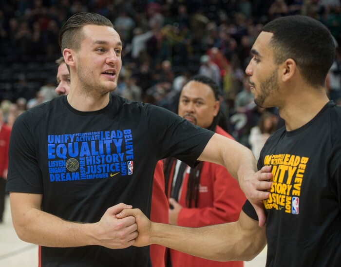 (Rick Egan  |  The Salt Lake Tribune)    Dallas Mavericks guard Kyle Collinsworth (8) greets Utah Jazz guard Naz Mitrou-Long (30) after the game between Utah Jazz and Dallas Mavericks in Salt Lake City, Saturday, Feb. 24, 2018.