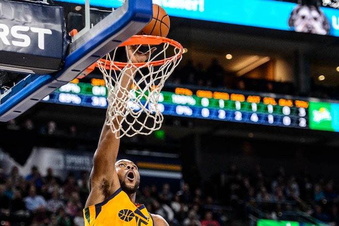 (Trent Nelson | The Salt Lake Tribune)  Utah Jazz forward Derrick Favors (15) tips in a lob from Utah Jazz forward Joe Ingles (2) as the Utah Jazz host the Milwaukee Bucks, NBA basketball in Salt Lake City Saturday November 25, 2017.