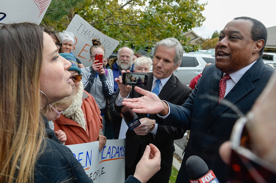 (Francisco Kjolseth | The Salt Lake Tribune) Breanne Hughes, left, argues with James Evans, former chair of the Utah Republican Party as two competing rallies spar near Rep. Ben McAdams' office in West Jordan, one seeking to support McAdams and one to criticize him for supporting the impeachment inquiry of President Donald Trump on Wednesday, Oct. 9, 2019.