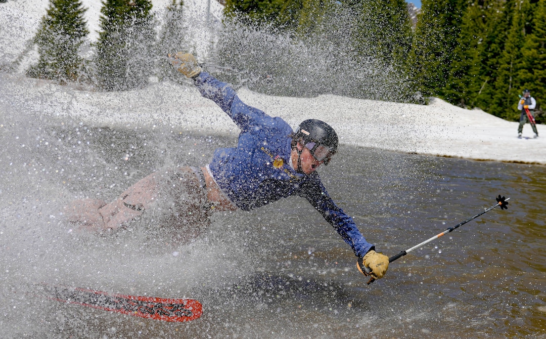 (Francisco Kjolseth  | The Salt Lake Tribune) Bill Busse takes a swim in the pond in Peruvian Gulch as Snowbird closes the book on the 2024-25 ski season on Monday, May 26, 2025. Snow and sun revelers took to the slushy slopes on Memorial Day as the resort was the last in the state to close.