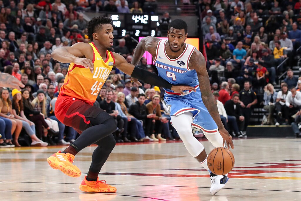 Sacramento Kings guard Iman Shumpert (9) tries to dribble past Utah Jazz guard Donovan Mitchell (45) and to the basket during the second quarter of an NBA basketball game, Wednesday, Nov. 21, 2018, in Salt Lake City. (AP Photo/Chris Nicoll)