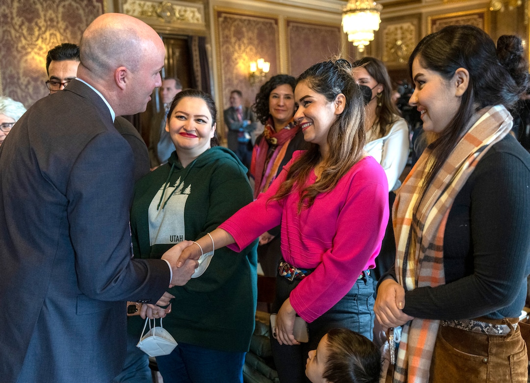 (Rick Egan | The Salt Lake Tribune) Gov. Spencer Cox meets with Afghan refugee sisters, Saida, Khatina and Kamila Emami, in the gold Room at the State Capitol before a news conference for "Afghan Day on the Hill" on Wednesday, Feb. 23, 2022.