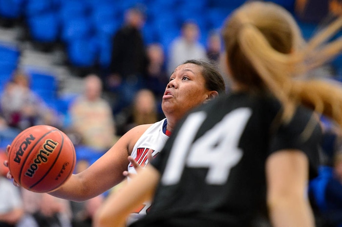 (Trent Nelson | The Salt Lake Tribune)  Woods Cross's Mele Tauataina (20) goes in for a shot as Woods Cross faces Highland in the 5A High School Girls' Basketball Tournament at SLCC in Taylorsville, Wednesday Feb. 21, 2018.