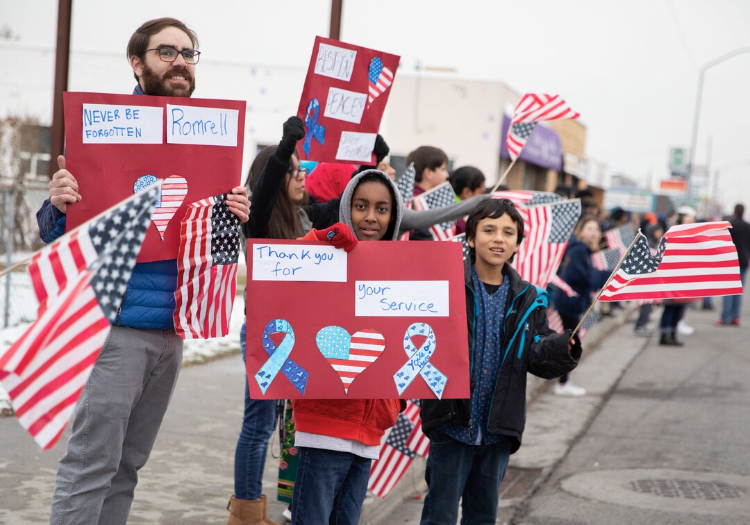 (Keith Johnson  |  special to The Salt Lake Tribune) Students and staff from Granite Park Jr. High line State Street near 3000 South to watch the funeral procession for Officer David Romrell Dec. 5, 2018 in South Salt Lake, Utah. Officer Romrell, a South Salt Lake police officer, was killed in the line of duty Nov. 24th when he was struck by a car driven by a fleeing suspect. 