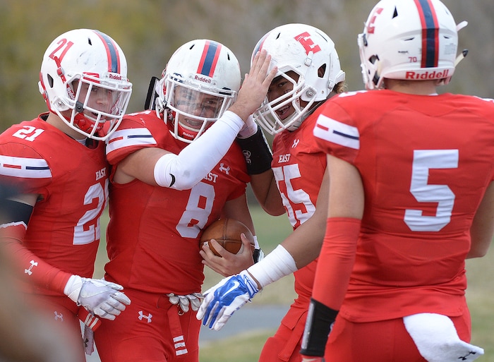 (Leah Hogsten  |  The Salt Lake Tribune) East's quarterback Ben Ford celebrates his touchdown with teammates.  American Fork High School boys' football team East High School during their class 6A state quarterfinal football game, Friday, November 3, 2017