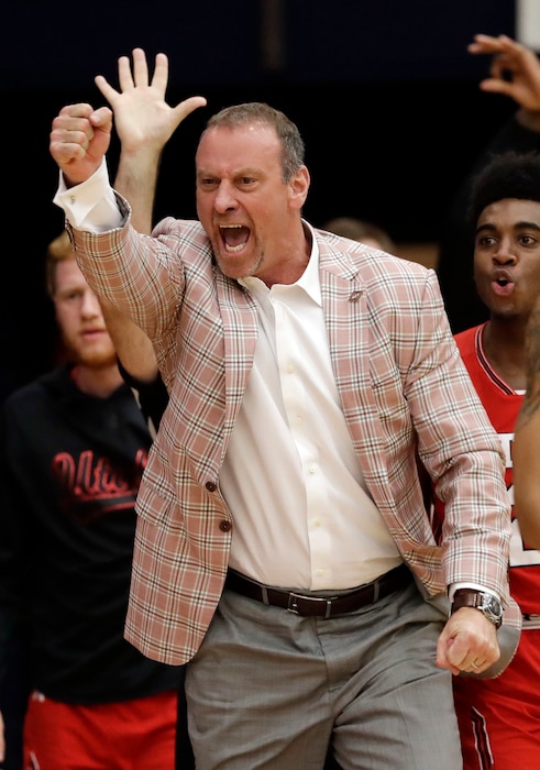 Utah coach Larry Krystkowiak reacts after a 3-point basket by Tyler Rawson during the second half of the team's NCAA college basketball game against Saint Mary's in the quarterfinals of the NIT, Wednesday, March 21, 2018, in Moraga, Calif. (AP Photo/Marcio Jose Sanchez)