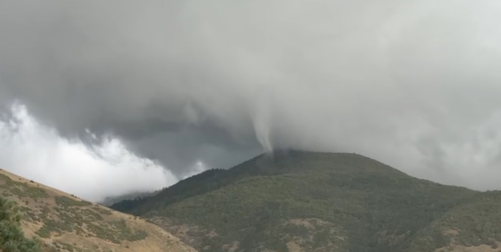 (Shon Stevenson) A video screenshot shows a tornado that touched down in the mountains above Fruit Heights, Friday, Sept. 18, 2026.