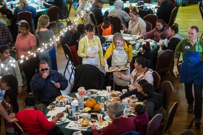 (Chris Detrick  |  The Salt Lake Tribune)  People eat during the annual Thanksgiving Day dinner at the Holy Trinity Cathedral in Salt Lake City  Thursday, November 23, 2017.  