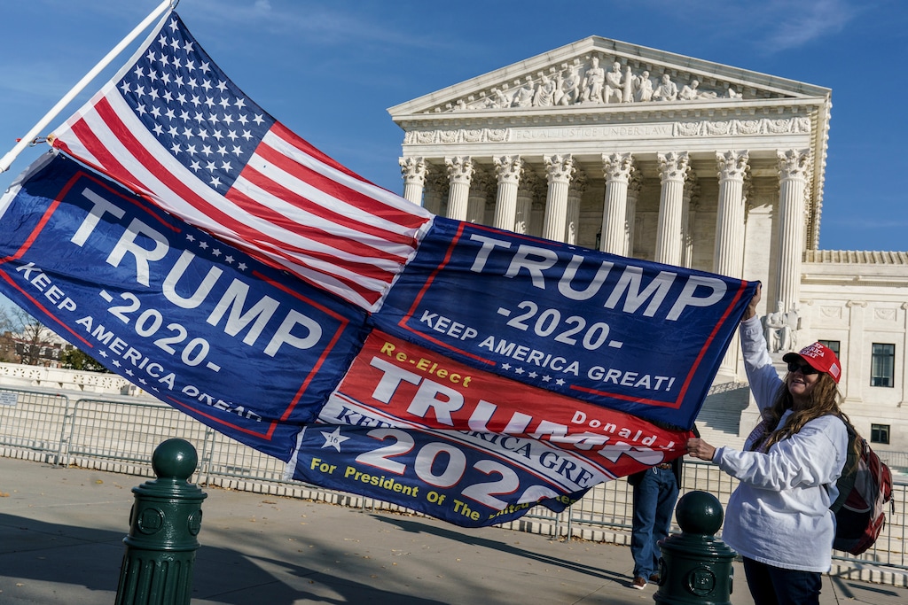 (J. Scott Applewhite | AP photo)

In this Dec. 11, 2020 file photo, Kathy Kratt of Orlando, Fla., displays her Trump flags as she and other protesters demonstrate their support for President Donald Trump at the Supreme Court in Washington.