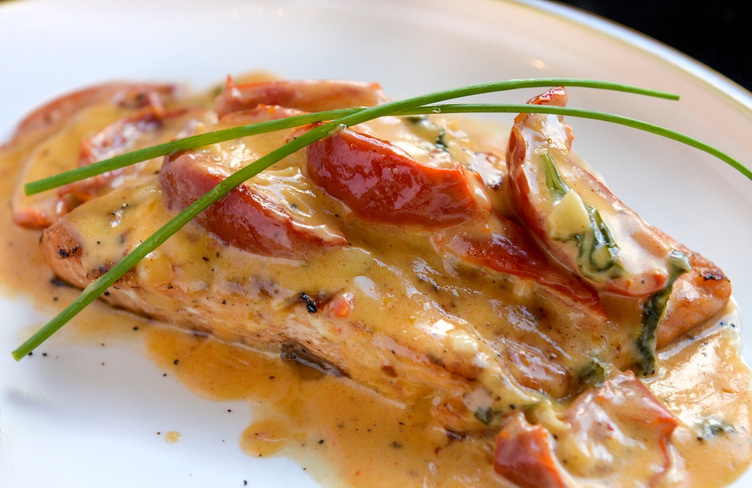 (Leah Hogsten  |  The Salt Lake Tribune) Dish of the week; Trancio di Salmone with Grilled salmon covered with a light cream of dried tomatoes, paprika, red chili pepper, garlic, and basil, $18 at Osteria Amore, serving traditional flavors of Italy with a modern spin, Jan. 10, 2020.