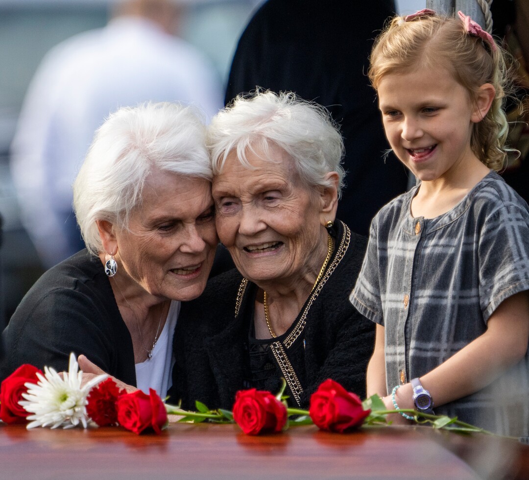 (Rick Egan | The Salt Lake Tribune)  Doris hugs her sister Elaine Hatch, as Scout Hoffman looks on, at the interment of Orrin Hatch at the Newton Cemetery, on Friday, May 6, 2022.