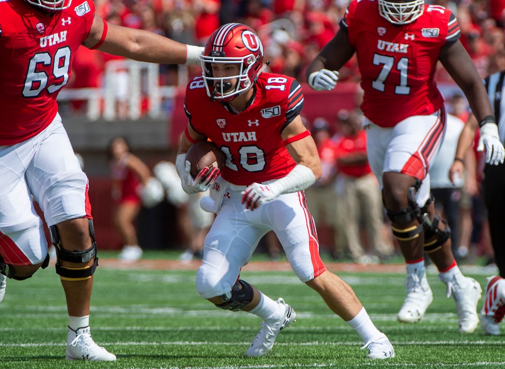 (Rick Egan  |  The Salt Lake Tribune)    Utah wide receiver Britain Covey (18) breaks a tackle and heads down field for the Utes, in football action between Northern Illinois Huskies and Utah Utes at Rice-Eccles Stadium, Saturday, Sept. 7, 2019.