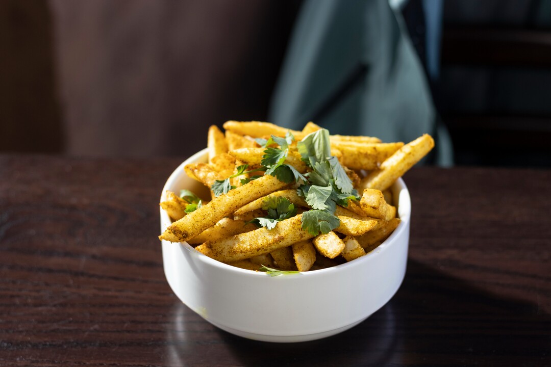 (Courtesy of Solitude) Solitude’s Roundhouse restaurant features fries tossed in spices and served up hot with curry aioli.