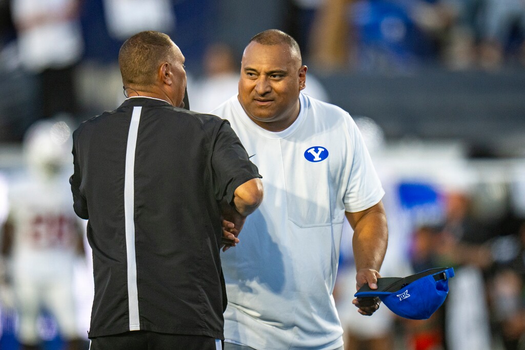 (Rick Egan | The Salt Lake Tribune) Brigham Young Cougars head coach Kalani Sitake shakes hands with one of hte officials before football action between the Brigham Young Cougars and the Stanford Cardinal, at Lavell Edwards Stadium on Saturday Sept. 6, 2025.