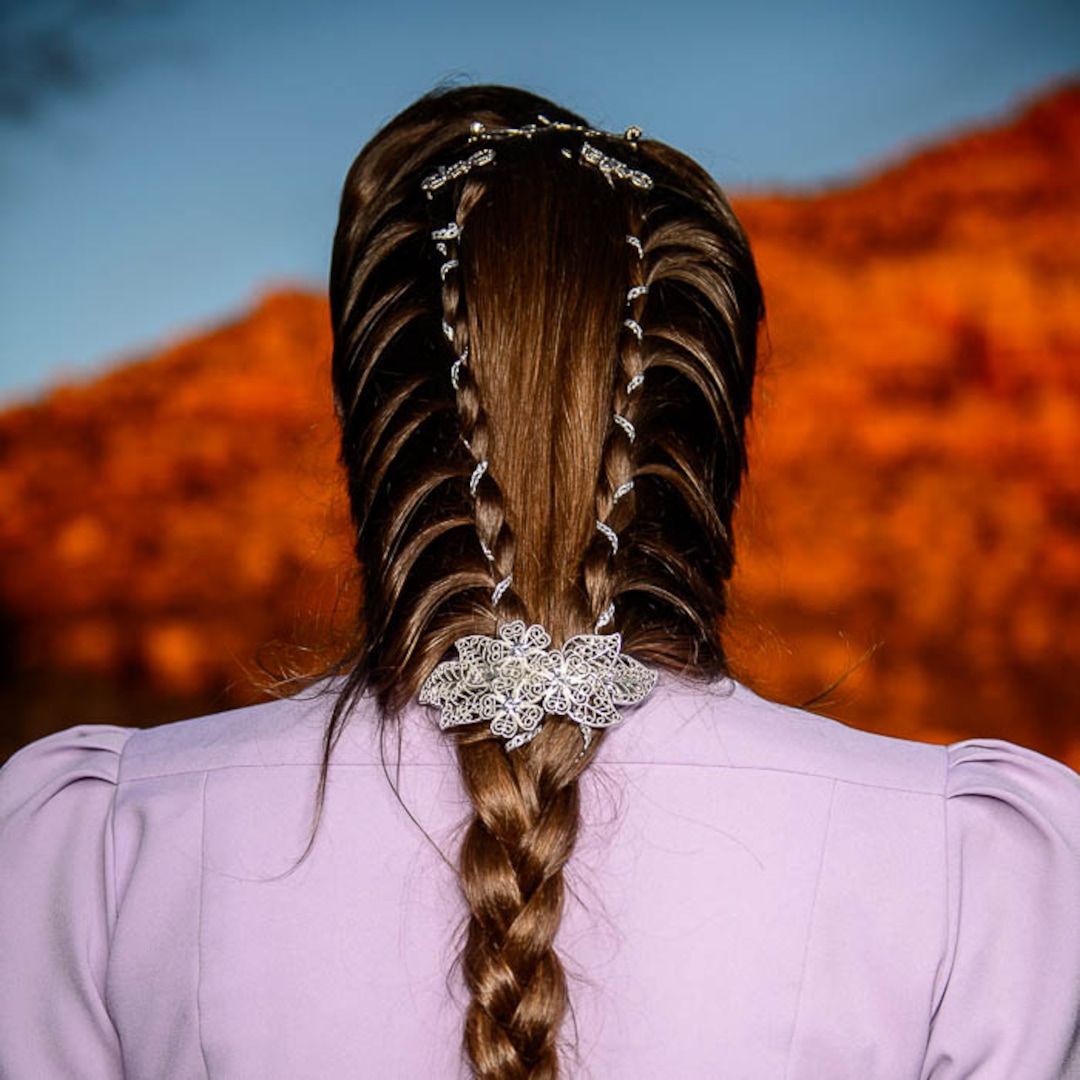 (Trent Nelson | The Salt Lake Tribune)  A princess party was thrown for several young FLDS girls in Colorado City, Ariz., Friday March 16, 2018, as a reward for reading books. Before the party, Angela Bistline showed her braids.
