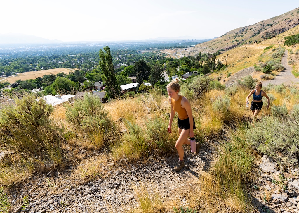 (Rick Egan | The Salt Lake Tribune)  Mira Petersen, and Kaitlyn Kunz hike  along the Granduer Peak trail, on Tuesday, Aug. 2, 2022.