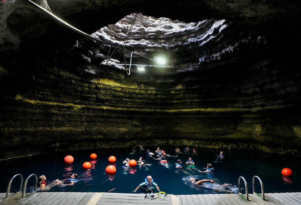 (Francisco Kjolseth | The Salt Lake Tribune) People float in The Crater at the Homestead in Midway where extensive changes are taking place all around it. Utah Luxury Group, a premier boutique real estate firm specializing in high-end mountain properties, has been completing their Autograph Collection Residences, Thursday, Aug. 14, 2026.