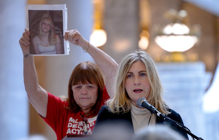 (Francisco Kjolseth  |  The Salt Lake Tribune) Carolyn Tuft, right, who survived the 2007 mass shooting at Trolley Square that left her with lead poisoning from shotgun pellets still in her body, talks about her daughter Kirsten Hinckley who was killed that day as her portrait is held up by Mary Ann Thompson of Mom's Demand Action for Gun Sense, during a rally at the Utah Capitol on Saturday, Feb. 15, 2020.