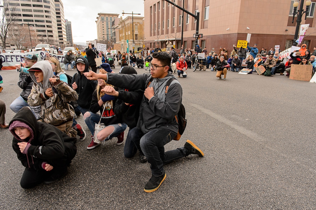 (Trent Nelson | The Salt Lake Tribune)  Protesters block an intersection downtown after a rally against a visit by President Donald Trump, Monday December 4, 2017.