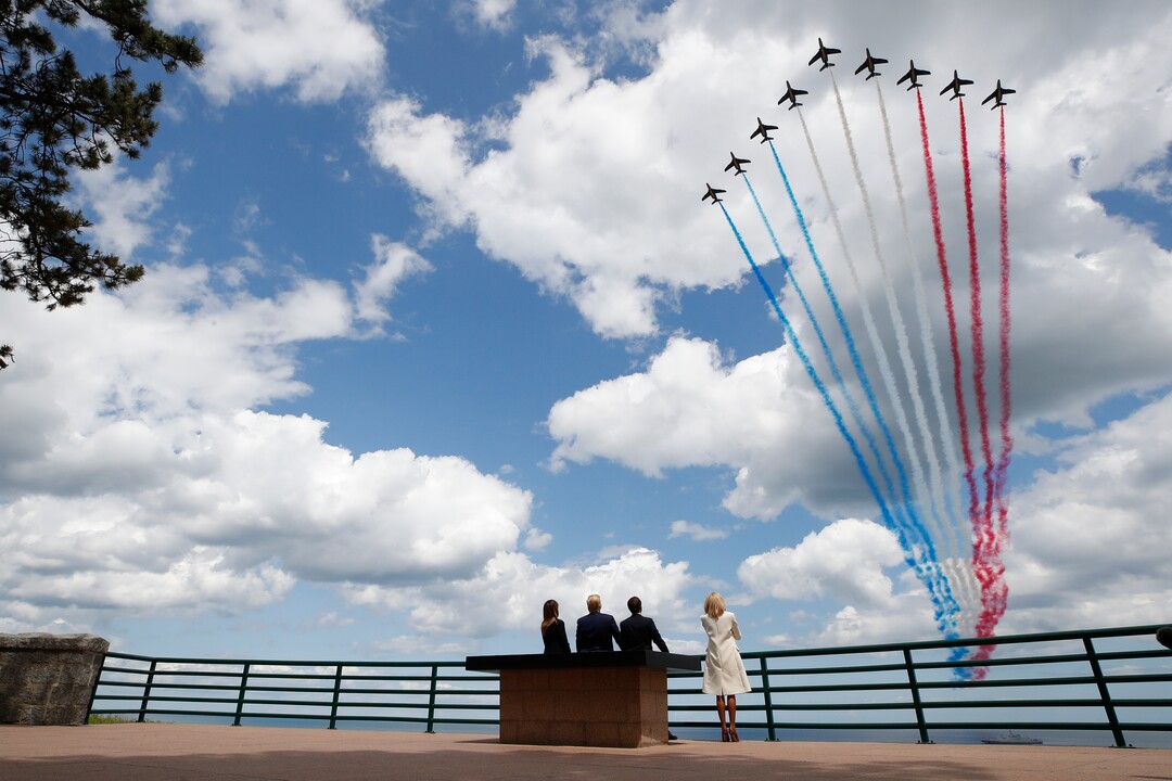 (Alex Brandon | AP) President Donald Trump, first lady Melania Trump, French President Emmanuel Macron and Brigitte Macron, watch a flyover during a ceremony to commemorate the 75th anniversary of D-Day at the American Normandy cemetery, Thursday, June 6, 2019, in Colleville-sur-Mer, Normandy, France.